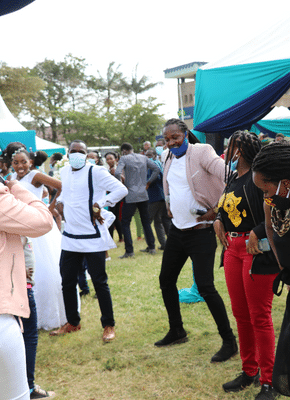 MC leading on dancing moves during a wedding reception