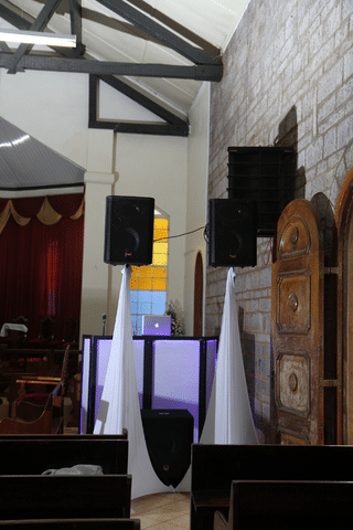 PA system with a façade setup in catholic church for a wedding ceremony